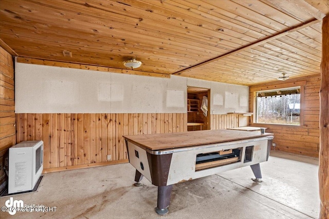 recreation room featuring wood ceiling, a wainscoted wall, heating unit, and wooden walls