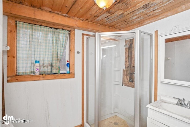 bathroom featuring vanity, wooden ceiling, and walk in shower