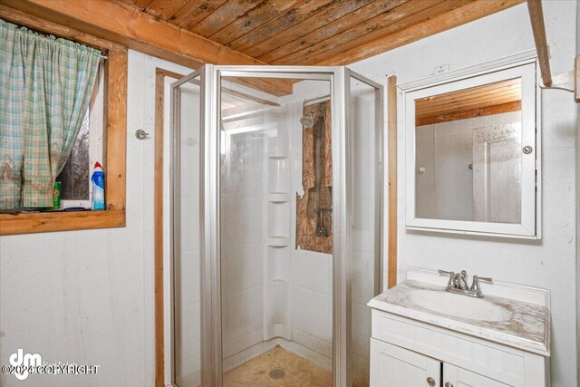 bathroom with wood ceiling, vanity, and an enclosed shower