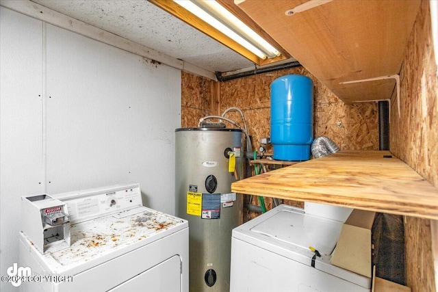 laundry area featuring independent washer and dryer and water heater