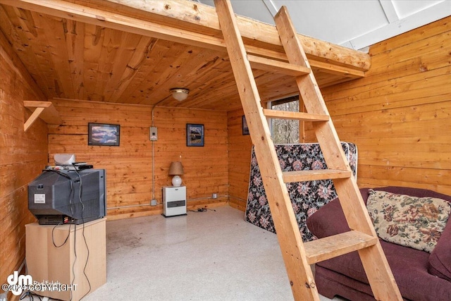 bedroom with wood ceiling and wooden walls