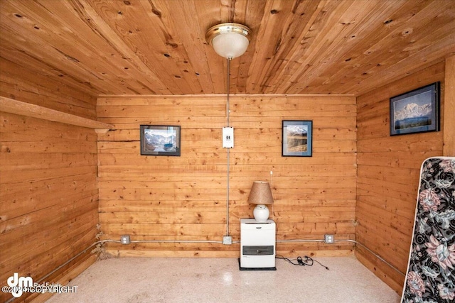 unfurnished room with wooden ceiling and wood walls