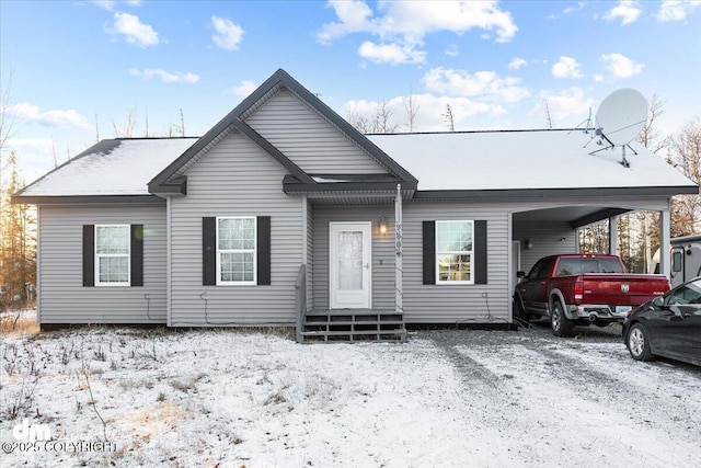 view of front of property featuring a carport