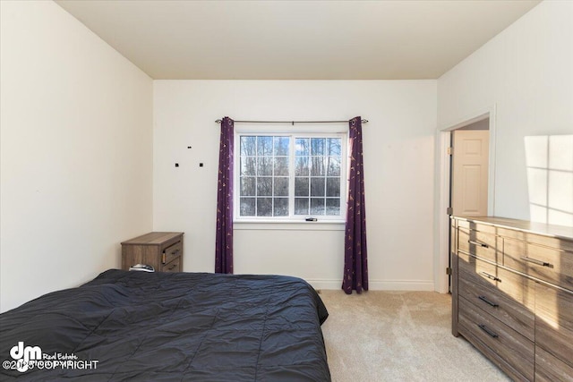 bedroom featuring light colored carpet