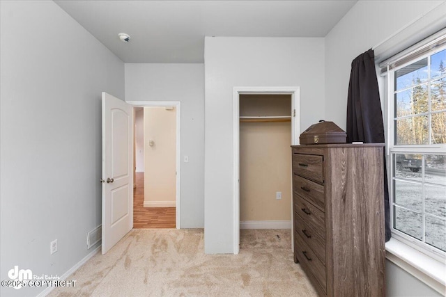 bedroom featuring light carpet