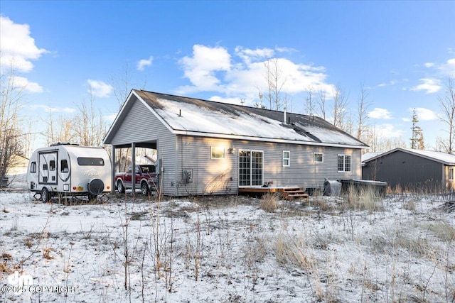 view of snow covered house