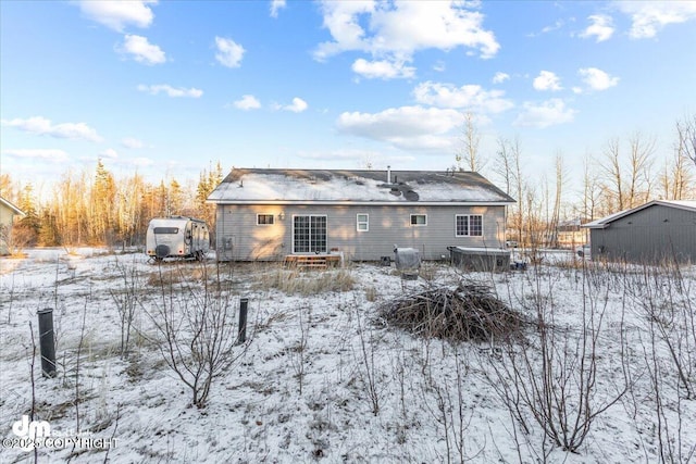 view of snow covered house