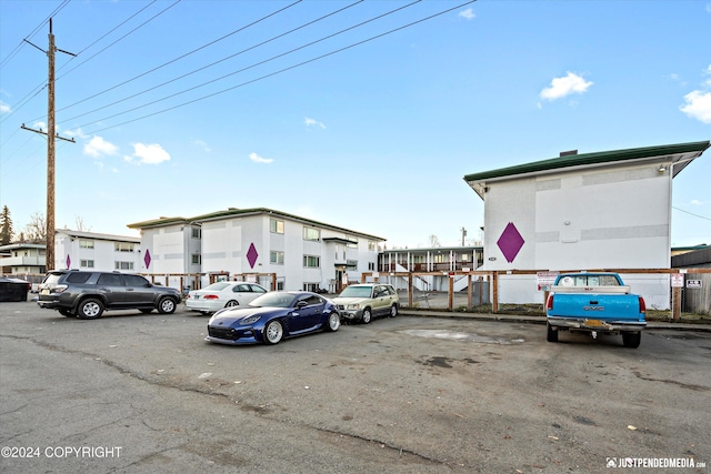 uncovered parking lot with fence