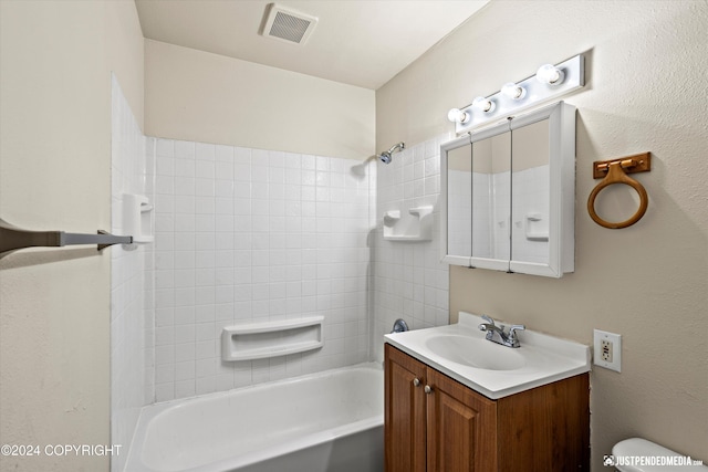 full bath with visible vents, toilet, vanity, and bathing tub / shower combination