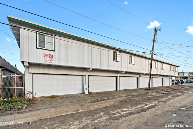 garage with fence