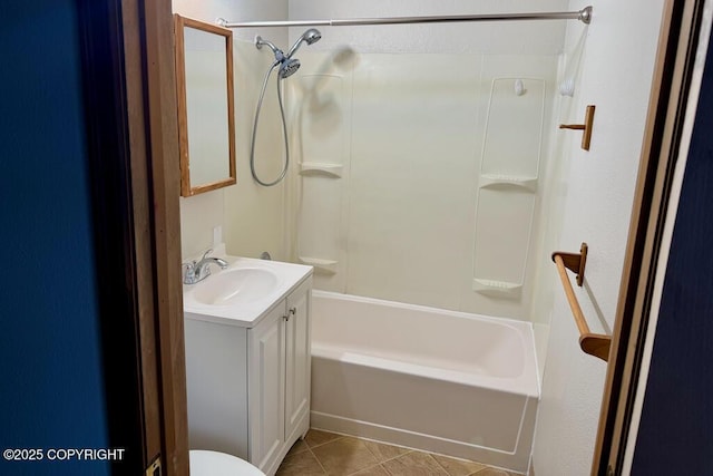 bathroom featuring tub / shower combination, toilet, vanity, and tile patterned flooring