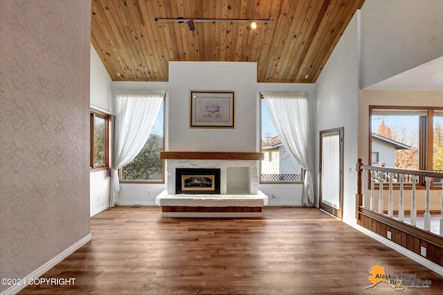 unfurnished living room featuring wood ceiling, hardwood / wood-style flooring, and high vaulted ceiling