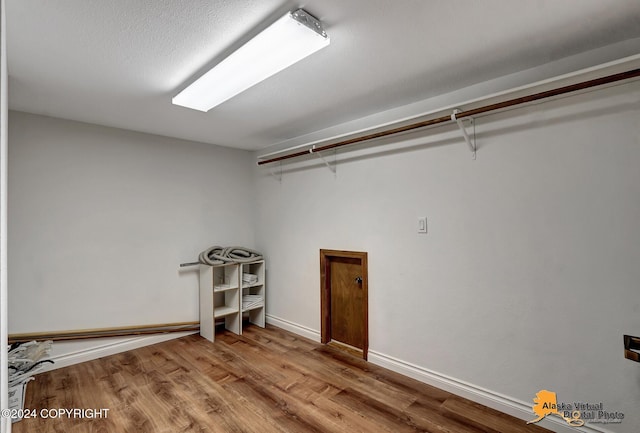 washroom with light hardwood / wood-style flooring