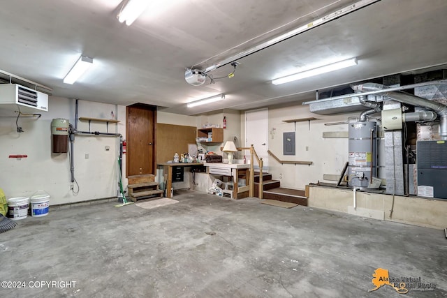 garage with a garage door opener, electric panel, and water heater