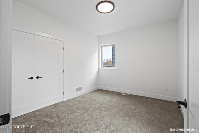 5376 Sandhill Loop, Anchorage, AK 99502 - carpeted empty room featuring baseboards and visible vents