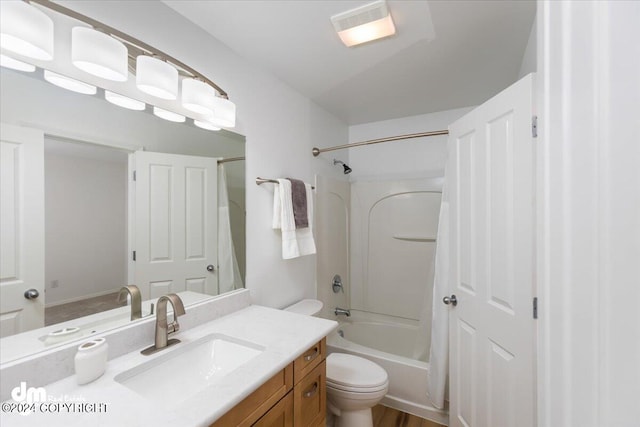 full bathroom with toilet, shower / washtub combination, vanity, and wood-type flooring