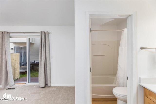 full bathroom with vanity, shower / tub combo with curtain, and toilet