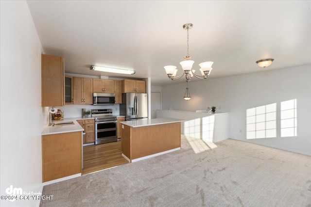 kitchen with a kitchen island, hanging light fixtures, stainless steel appliances, light carpet, and sink