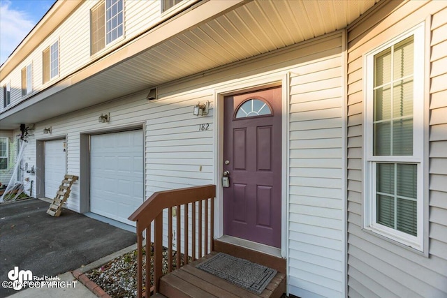 entrance to property featuring a garage