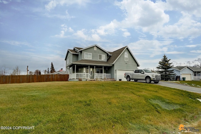 view of front facade featuring a garage, a porch, and a front lawn