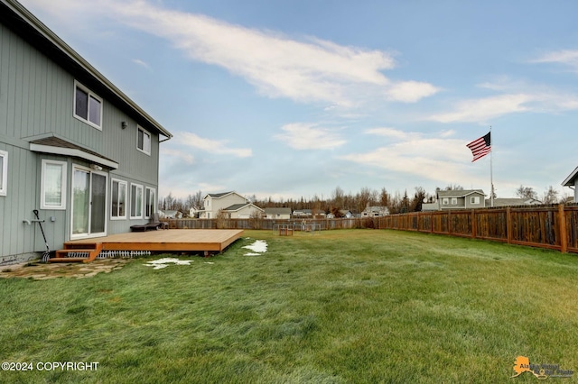 view of yard featuring a wooden deck