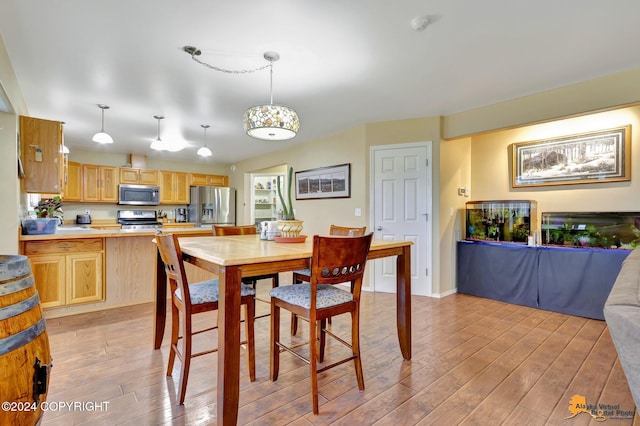 dining room with light wood-type flooring