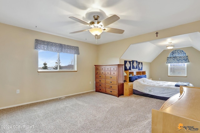 bedroom with ceiling fan, multiple windows, vaulted ceiling, and carpet