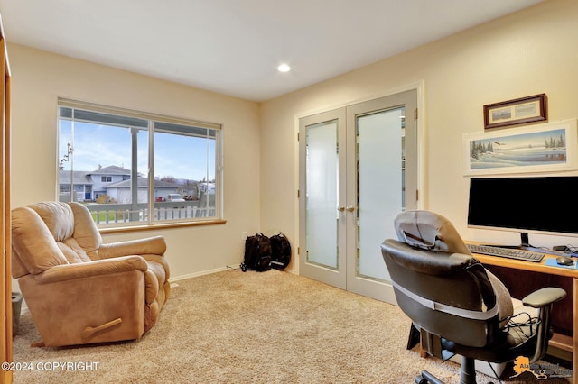 carpeted office space featuring french doors