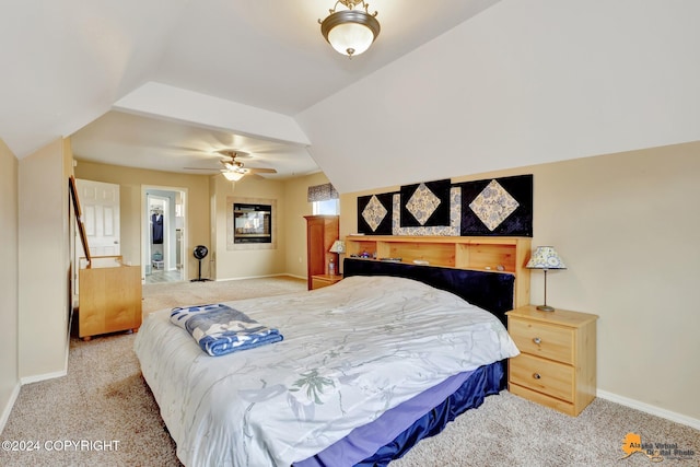 carpeted bedroom with lofted ceiling and ceiling fan