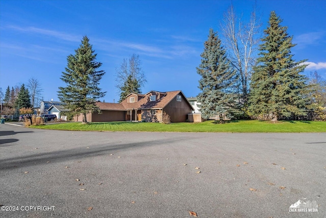8111 Northview Dr, Anchorage, AK 99504 - view of home's exterior featuring a lawn