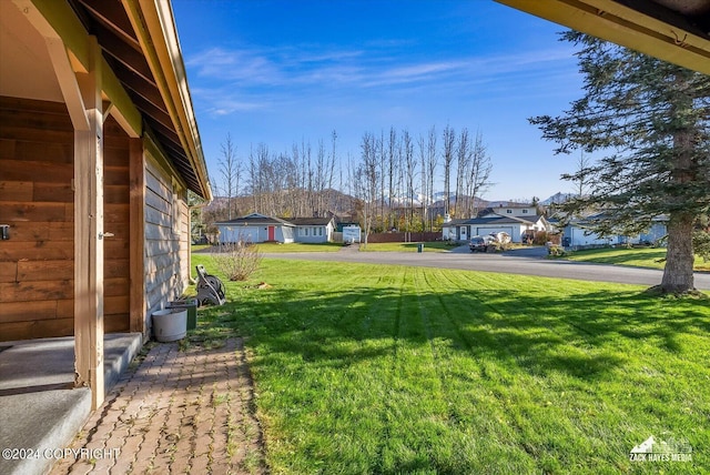 8111 Northview Dr, Anchorage, AK 99504 - view of green lawn featuring a residential view