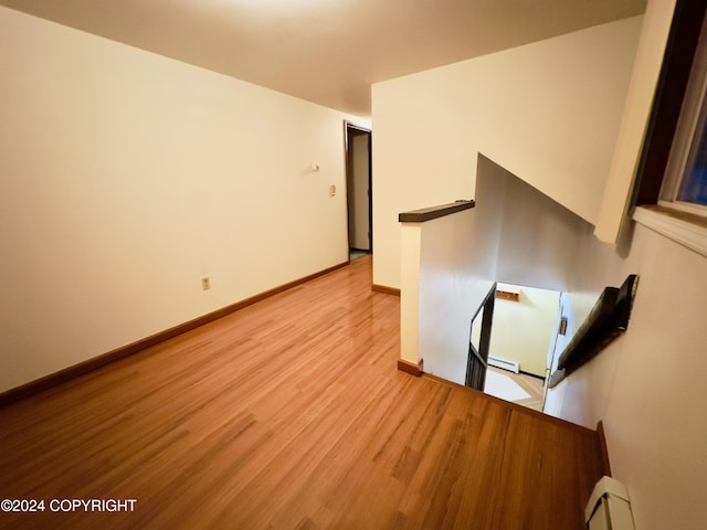 8111 Northview Dr, Anchorage, AK 99504 - unfurnished room featuring light wood-type flooring, baseboards, and a baseboard radiator