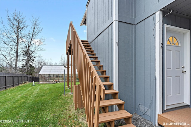 doorway to property with a yard