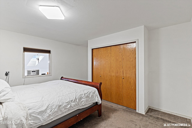 carpeted bedroom featuring a closet