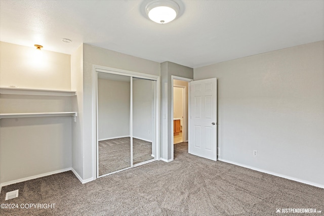 unfurnished bedroom with carpet floors