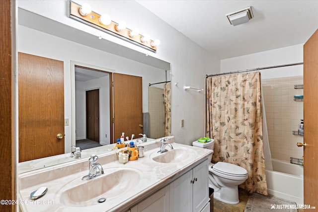 full bathroom with shower / bathtub combination with curtain, vanity, and toilet