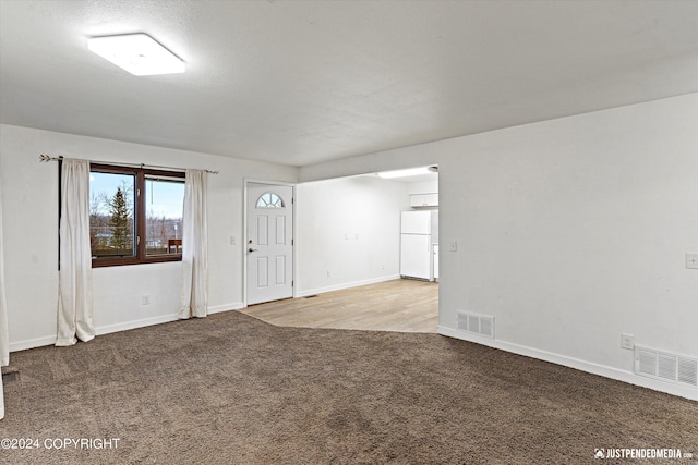 interior space featuring light colored carpet