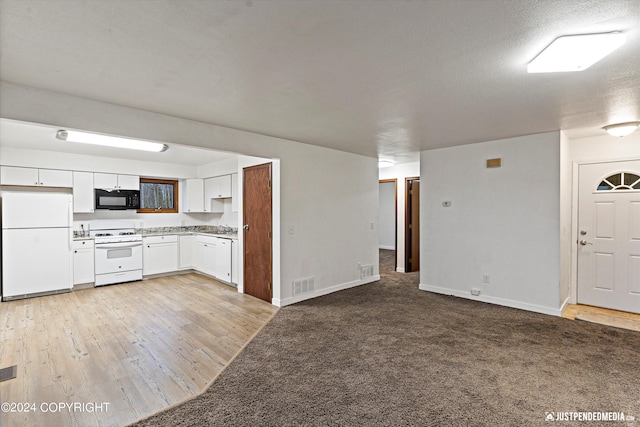 kitchen featuring a textured ceiling, light hardwood / wood-style floors, white appliances, and white cabinetry