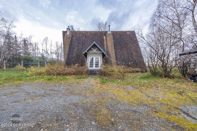 4480 E 138th Ave, Anchorage, AK 99516 - a-frame home featuring a chimney and french doors