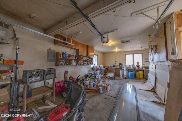 4480 E 138th Ave, Anchorage, AK 99516 - garage with a workshop area, electric panel, and a garage door opener