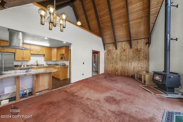 4480 E 138th Ave, Anchorage, AK 99516 - unfurnished living room featuring a wood stove, a sink, high vaulted ceiling, wooden walls, and wood ceiling with exposed beams