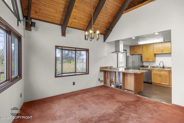 4480 E 138th Ave, Anchorage, AK 99516 - kitchen featuring appliances with stainless steel finishes, wood ceiling with exposed beams, a peninsula, ventilation hood, and healthy amount of natural light