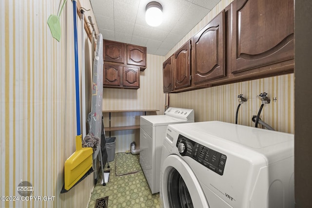 4480 E 138th Ave, Anchorage, AK 99516 - laundry room featuring cabinet space, separate washer and dryer, wallpapered walls, and light flooring