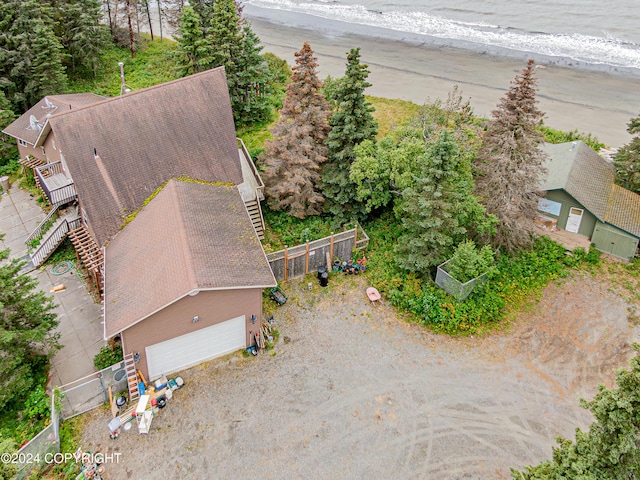 drone / aerial view featuring a beach view and a water view