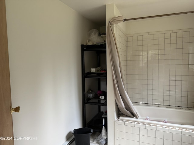 full bath featuring tiled shower / bath