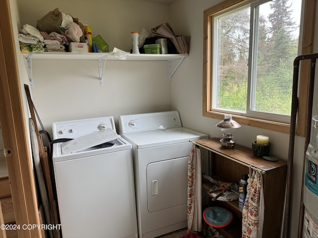 laundry room featuring independent washer and dryer and laundry area