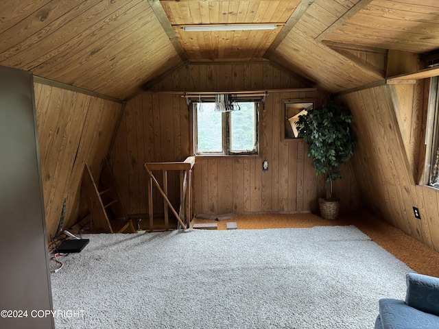 bonus room featuring vaulted ceiling, wood walls, carpet floors, and wooden ceiling