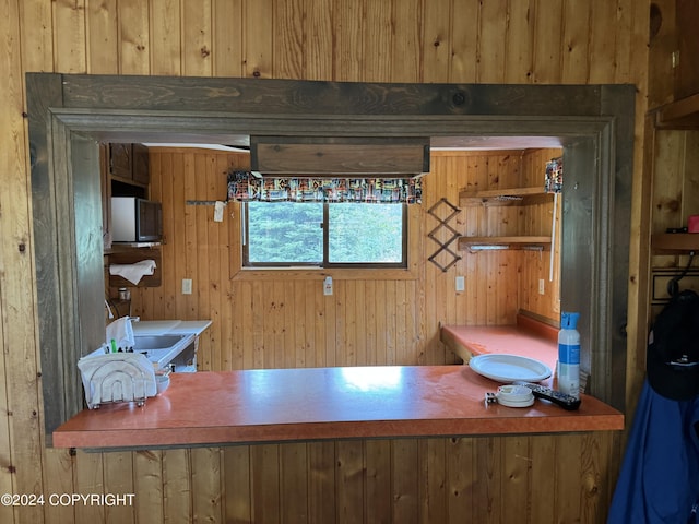unfurnished office with wood walls
