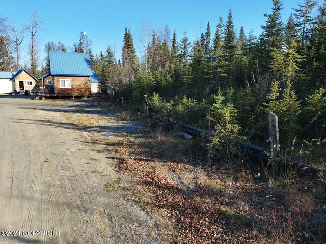 65449 Lingonberry Rd, Ninilchik, AK 99639 - view of street featuring dirt driveway