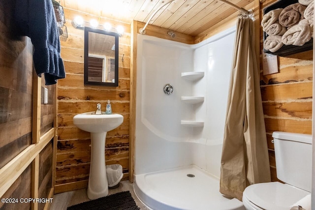 bathroom featuring toilet, walk in shower, wooden walls, and wooden ceiling